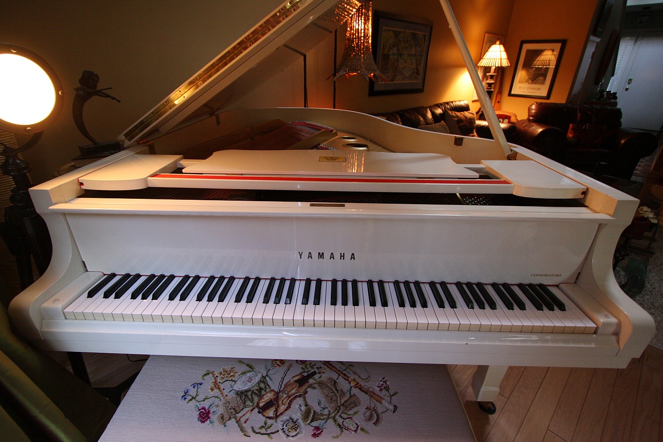 The white Yamaha grand piano in Ron Oates' studio