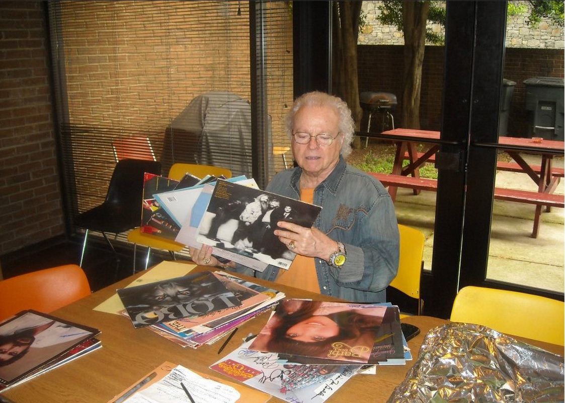 Ron Autographing Albums